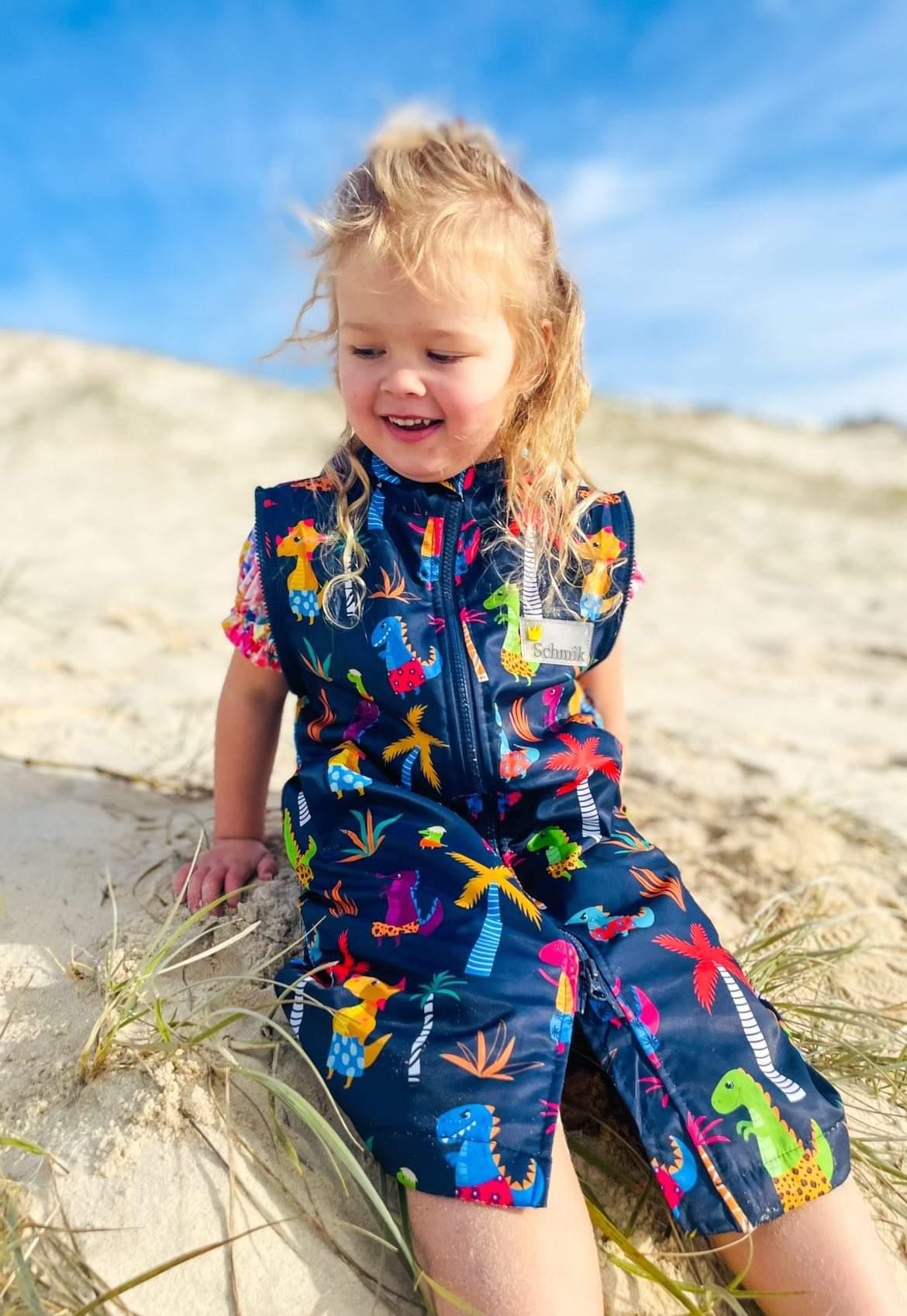 Beach fun in our Dinosaur print swim parka. Schmik swim parkas can be used instead of a towel, and keep kids and adult swimmers worn.