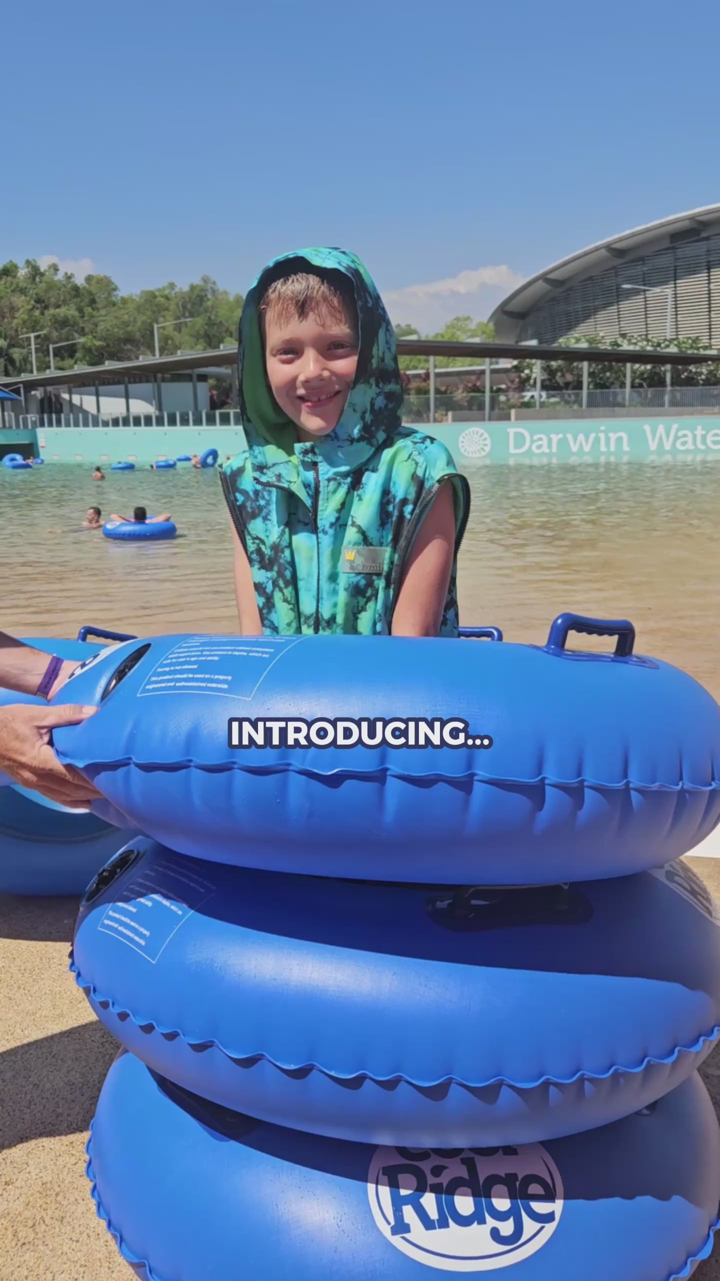 Load video: Schmik swim parka Neon Dream. All season swim parka with removable sleeves. Perfect for beach and pool days. 