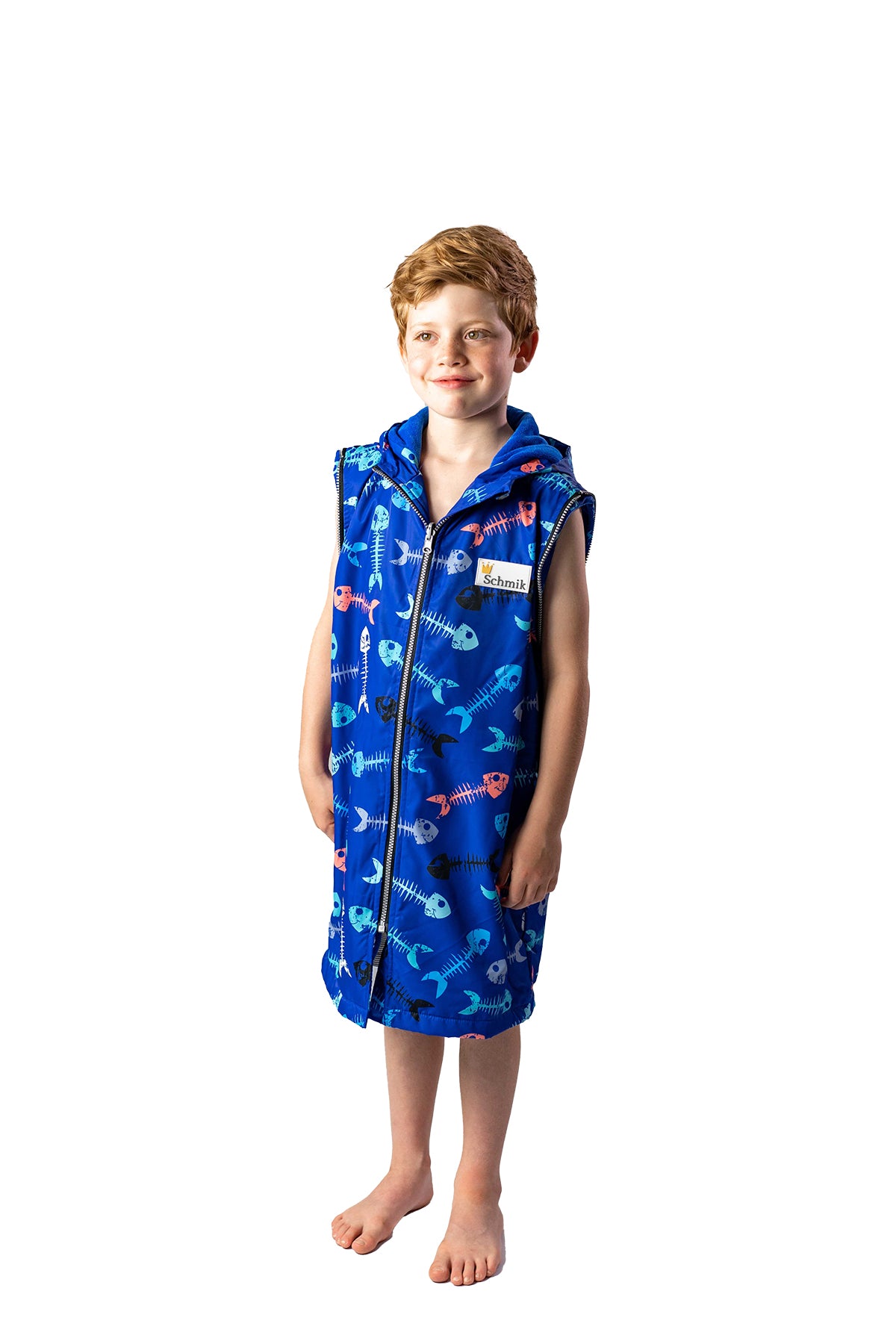 7 year old boy wearing a size 10 fishbone print swim parka. Swim parka has its arms removed.