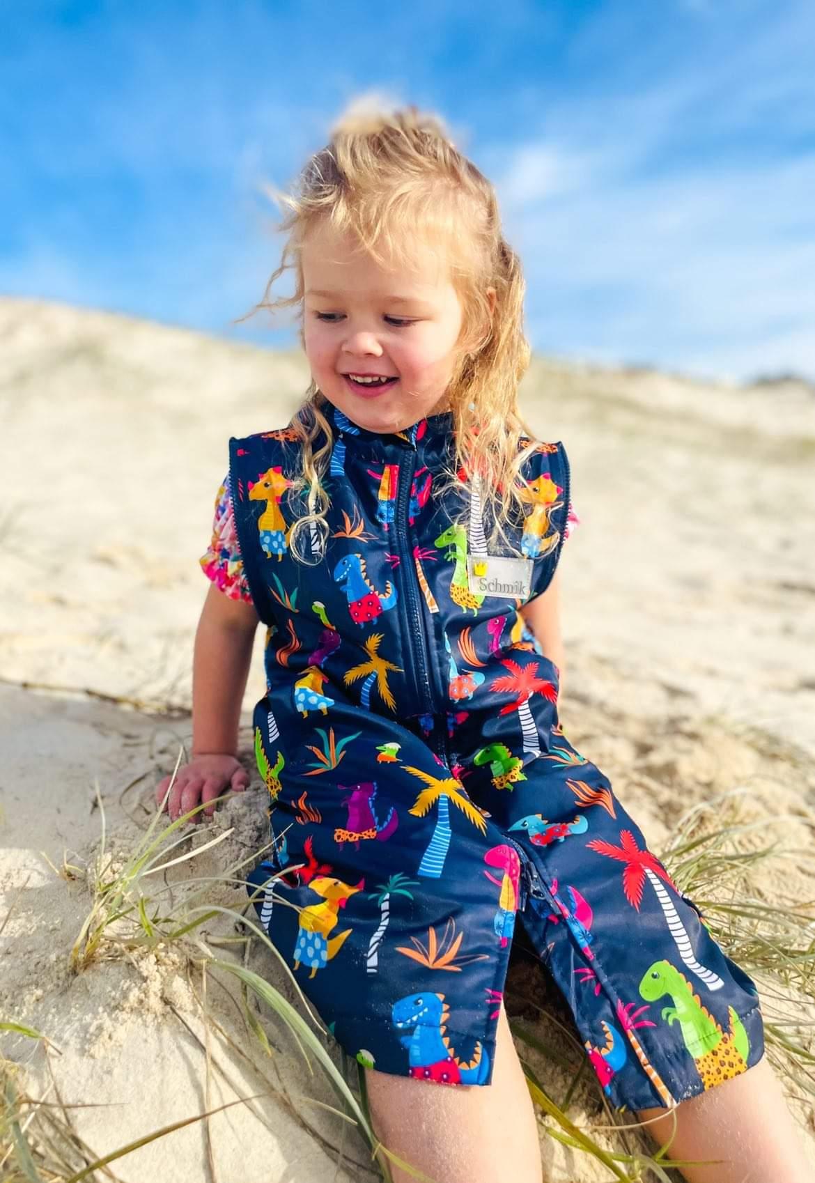 Beach fun in our Dinosaur print swim  parka. Schmik swim parkas can be used instead of a towel, and keep kids and adult swimmers worn. 