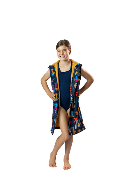 Removable sleeves. Swim parka worn by girl with sleeves removed for summer days. Schmik swim parkas sold by Schmik on amazon.comm and shopify store.